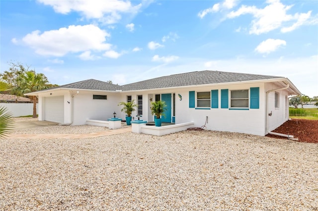 3611 22nd Ave W, Bradenton, FL 34205 - back of property with a garage, driveway, covered porch, and roof with shingles