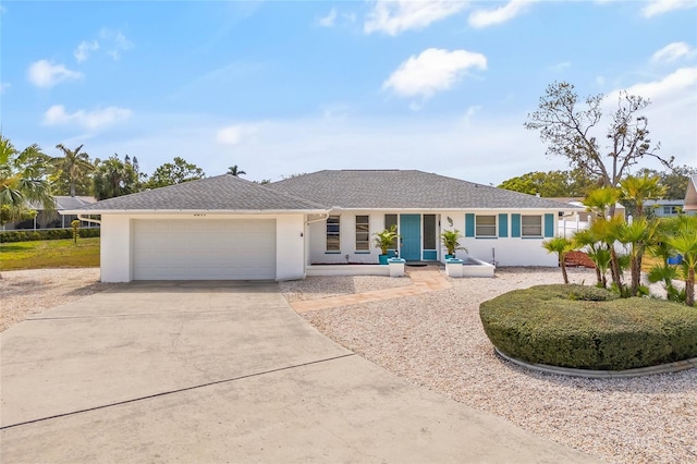 3611 22nd Ave W, Bradenton, FL 34205 - ranch-style house with a garage, concrete driveway, and stucco siding