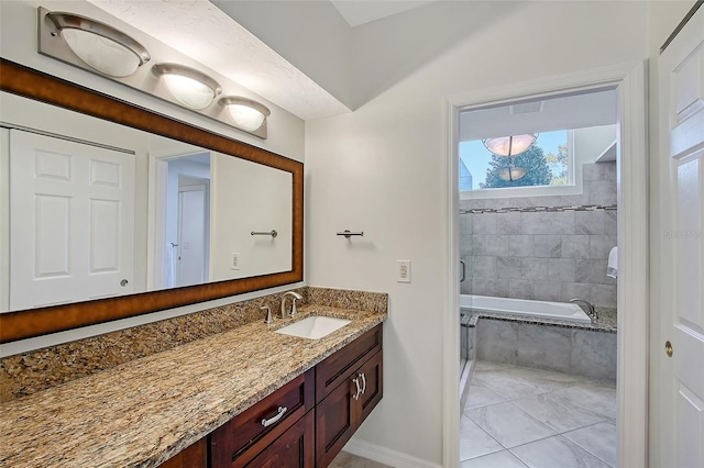 full bath featuring tiled shower / bath, visible vents, and vanity