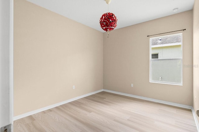 11790 Fennemore Way, Parrish, FL 34219 - unfurnished room featuring light wood-style floors and baseboards