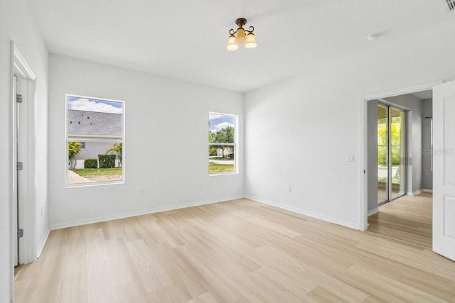 11790 Fennemore Way, Parrish, FL 34219 - unfurnished room featuring baseboards and light wood-type flooring
