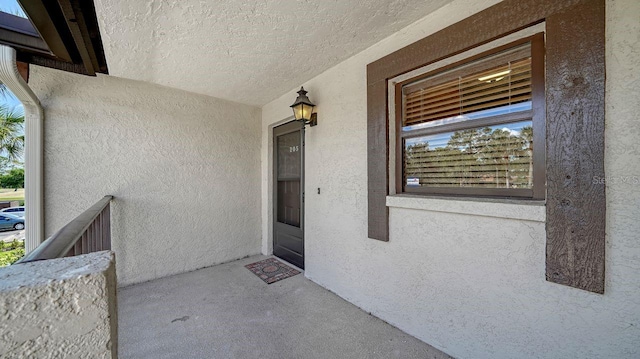5630 Golf Pointe Dr Unit 205, Sarasota, FL 34243 - view of exterior entry with stucco siding
