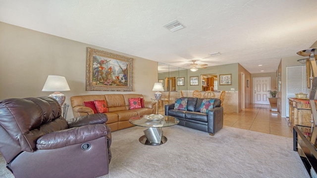5630 Golf Pointe Dr Unit 205, Sarasota, FL 34243 - living area with visible vents, a ceiling fan, light colored carpet, and light tile patterned flooring