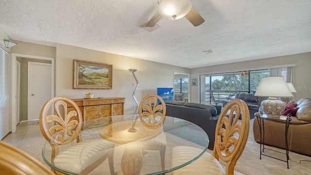 5630 Golf Pointe Dr Unit 205, Sarasota, FL 34243 - dining space featuring visible vents, a textured ceiling, and ceiling fan