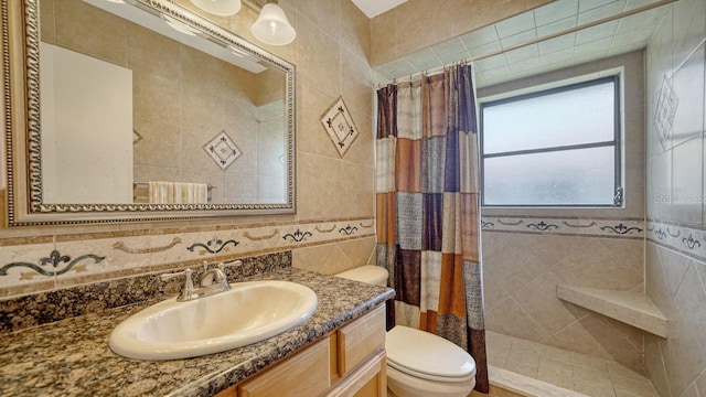 5630 Golf Pointe Dr Unit 205, Sarasota, FL 34243 - full bathroom with toilet, tile walls, tiled shower, and vanity