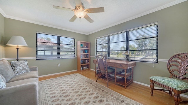 5630 Golf Pointe Dr Unit 205, Sarasota, FL 34243 - office area featuring light wood-style floors, a ceiling fan, and crown molding