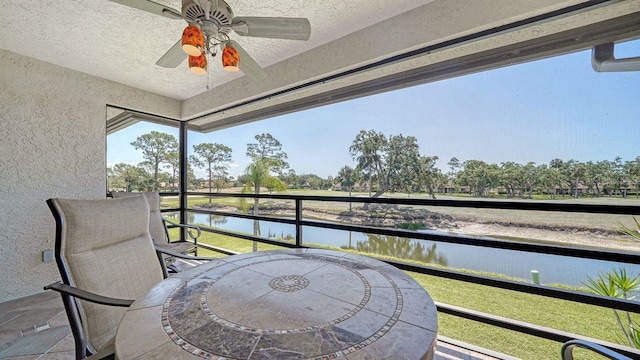 5630 Golf Pointe Dr Unit 205, Sarasota, FL 34243 - balcony featuring a water view and ceiling fan