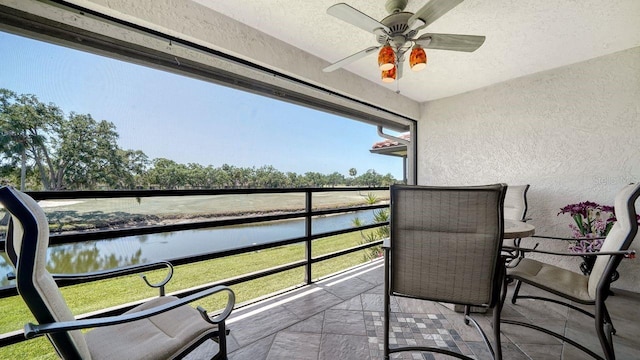 5630 Golf Pointe Dr Unit 205, Sarasota, FL 34243 - balcony featuring a water view and ceiling fan
