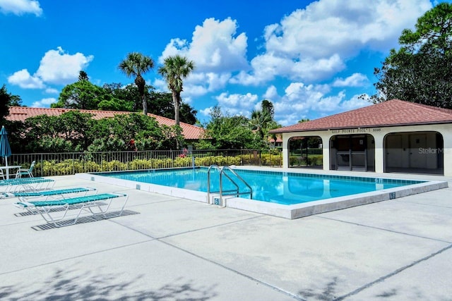 5630 Golf Pointe Dr Unit 205, Sarasota, FL 34243 - community pool with a patio area and fence