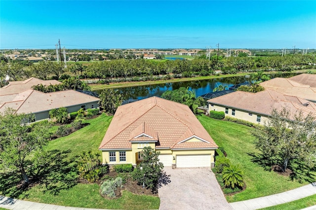 birds eye view of property with a water view