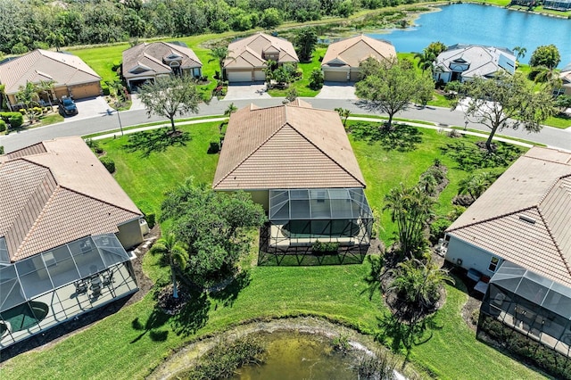 bird's eye view with a residential view and a water view