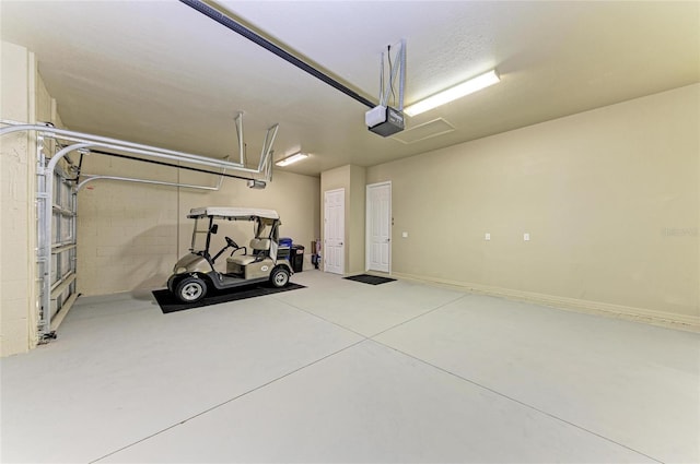 garage featuring a garage door opener