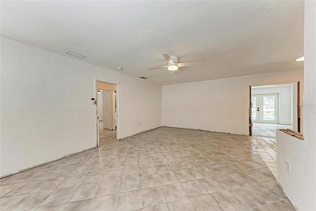 3304 7th Street Ct W, Palmetto, FL 34221 - empty room with a ceiling fan and light tile patterned flooring