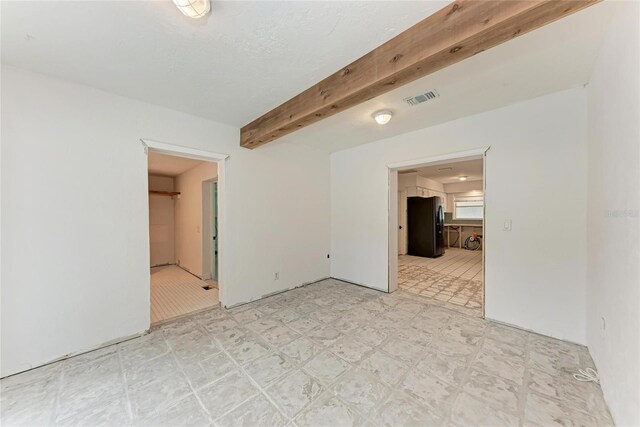 3304 7th Street Ct W, Palmetto, FL 34221 - empty room featuring light floors and beam ceiling