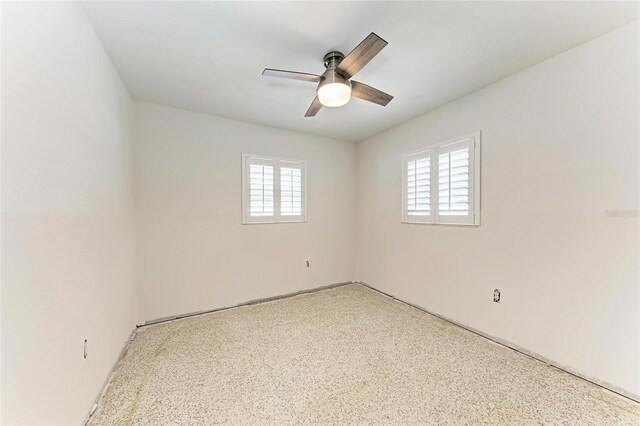 3304 7th Street Ct W, Palmetto, FL 34221 - spare room with ceiling fan and speckled floor