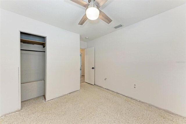 3304 7th Street Ct W, Palmetto, FL 34221 - unfurnished bedroom featuring speckle patterned floor, a closet, and ceiling fan