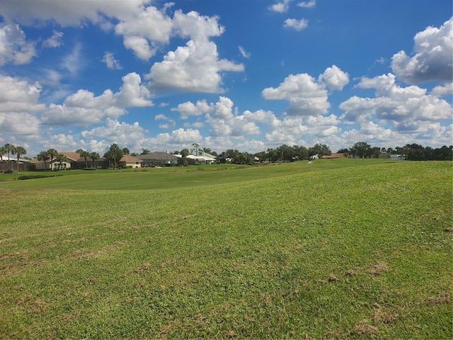view of yard with a residential view and golf course view