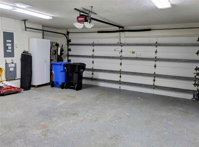 garage featuring a garage door opener and electric panel