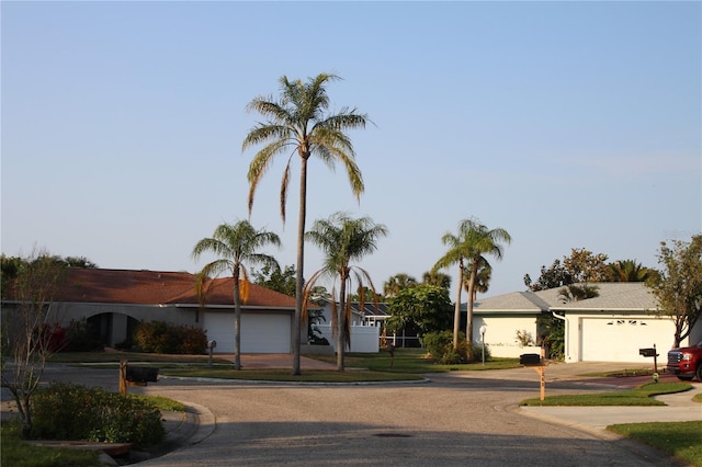 1862 Orangewood Ln, Sarasota, FL 34232 - view of front of home with concrete driveway and an attached garage