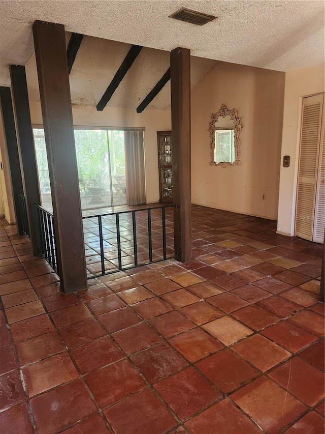1862 Orangewood Ln, Sarasota, FL 34232 - hallway featuring vaulted ceiling with beams, visible vents, and a textured ceiling