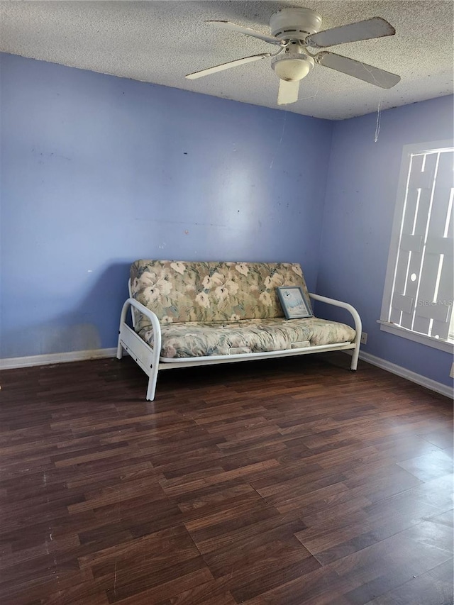 1862 Orangewood Ln, Sarasota, FL 34232 - living area featuring a ceiling fan, wood finished floors, baseboards, and a textured ceiling