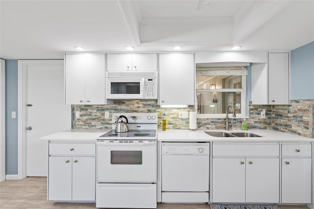 7122 11th Ave W, Bradenton, FL 34209 - kitchen with white cabinets, white appliances, light countertops, and a sink