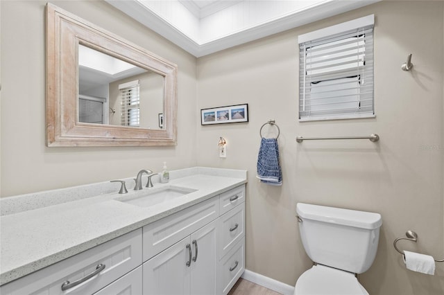 7122 11th Ave W, Bradenton, FL 34209 - bathroom featuring toilet, vanity, and baseboards