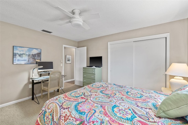 7122 11th Ave W, Bradenton, FL 34209 - bedroom featuring visible vents, a textured ceiling, a closet, carpet floors, and baseboards