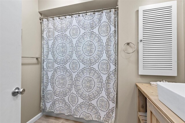 7122 11th Ave W, Bradenton, FL 34209 - bathroom featuring curtained shower and vanity