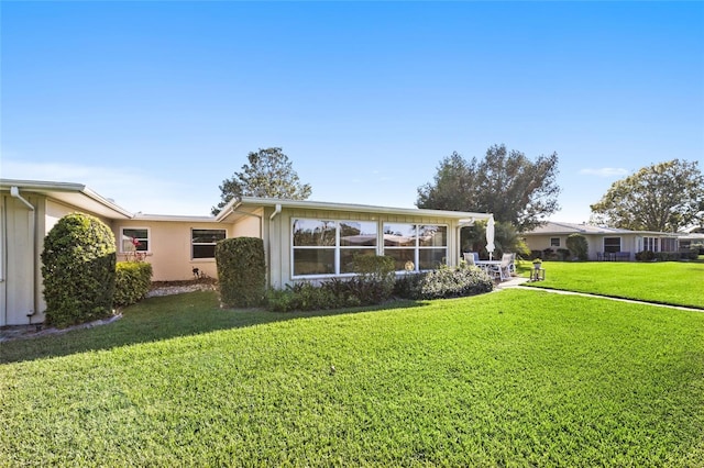 7122 11th Ave W, Bradenton, FL 34209 - view of front of house with stucco siding and a front lawn