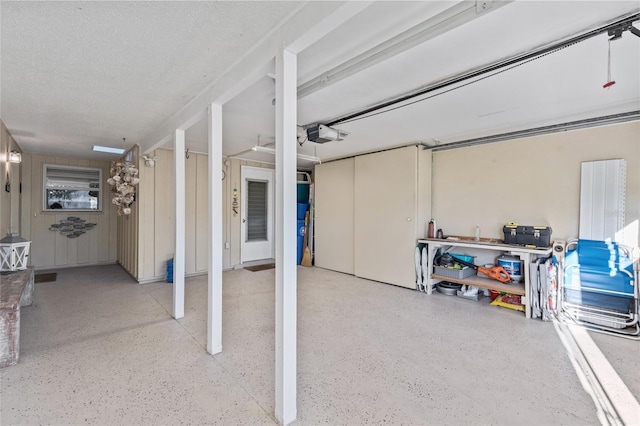 7122 11th Ave W, Bradenton, FL 34209 - basement featuring a textured ceiling and a garage