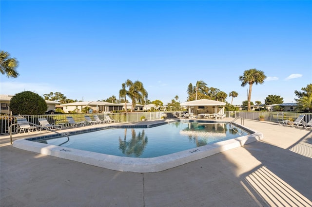 7122 11th Ave W, Bradenton, FL 34209 - community pool featuring a patio area and fence