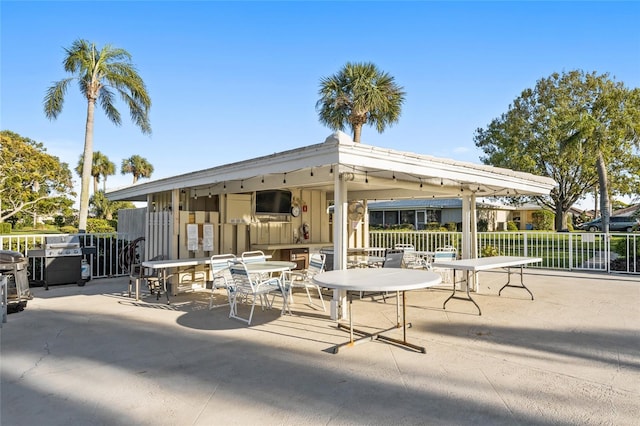7122 11th Ave W, Bradenton, FL 34209 - view of patio featuring outdoor dining space and fence
