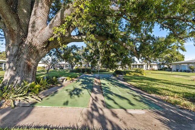 7122 11th Ave W, Bradenton, FL 34209 - view of property's community featuring shuffleboard and a lawn