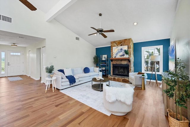 4406 17th St W, Palmetto, FL 34221 - living room with a ceiling fan, light wood-type flooring, plenty of natural light, a fireplace, and high vaulted ceiling