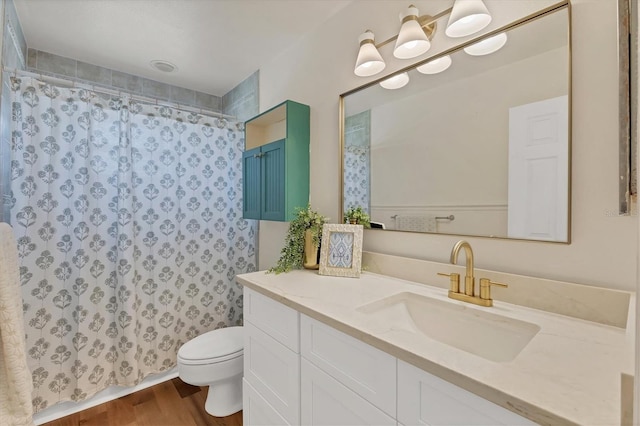 4406 17th St W, Palmetto, FL 34221 - bathroom with toilet, vanity, curtained shower, and wood finished floors