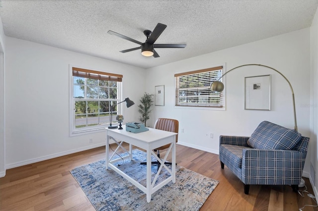 4406 17th St W, Palmetto, FL 34221 - office with wood finished floors, ceiling fan, baseboards, and a textured ceiling
