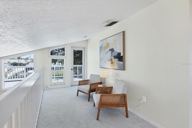 4406 17th St W, Palmetto, FL 34221 - living area featuring carpet flooring, a textured ceiling, and baseboards