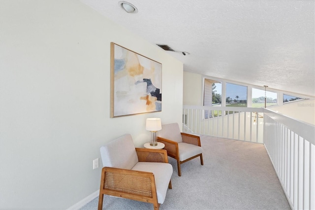 4406 17th St W, Palmetto, FL 34221 - sitting room with a textured ceiling and carpet