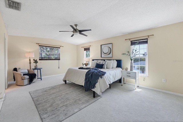 4406 17th St W, Palmetto, FL 34221 - carpeted bedroom featuring a textured ceiling, baseboards, a ceiling fan, and vaulted ceiling