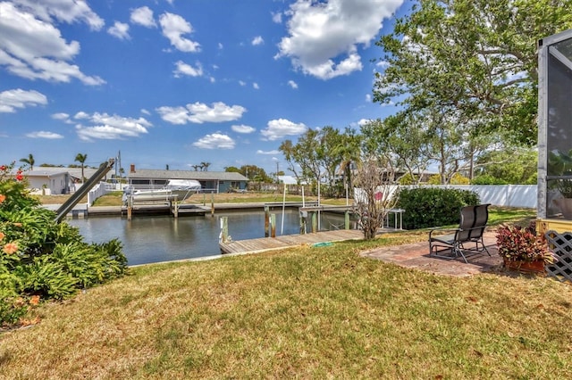 4406 17th St W, Palmetto, FL 34221 - view of green lawn with boat lift, a water view, and a boat dock