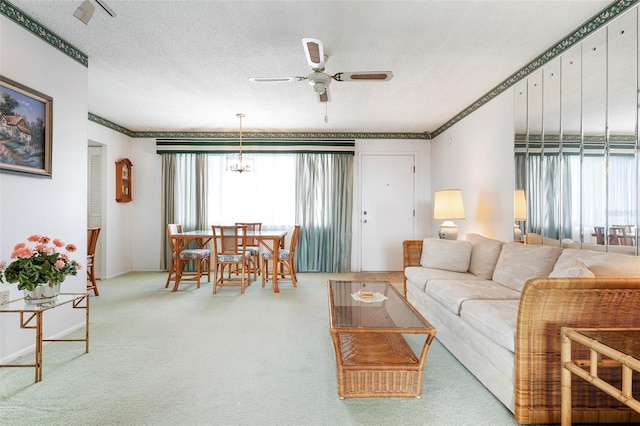 4440 Ironwood Cir Unit 509D, Bradenton, FL 34209 - carpeted living room with a ceiling fan, a chandelier, and baseboards