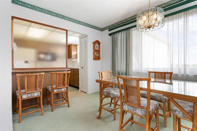 4440 Ironwood Cir Unit 509D, Bradenton, FL 34209 - dining space with plenty of natural light, a chandelier, light carpet, and baseboards