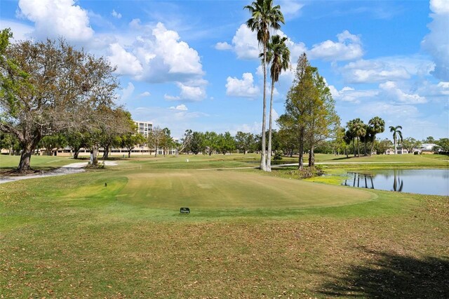 4440 Ironwood Cir Unit 509D, Bradenton, FL 34209 - surrounding community with golf course view, a yard, and a water view