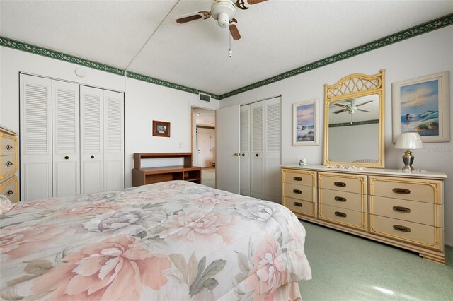 4440 Ironwood Cir Unit 509D, Bradenton, FL 34209 - bedroom with multiple closets, carpet, and a ceiling fan