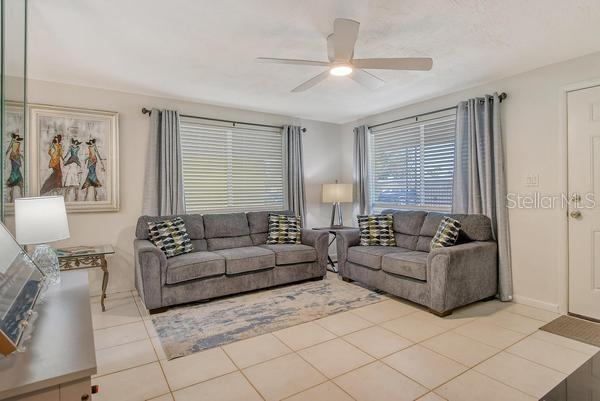 4560 Brooksdale Dr, Sarasota, FL 34232 - living area with a ceiling fan and tile patterned flooring