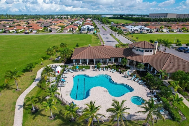 pool featuring a residential view and a patio