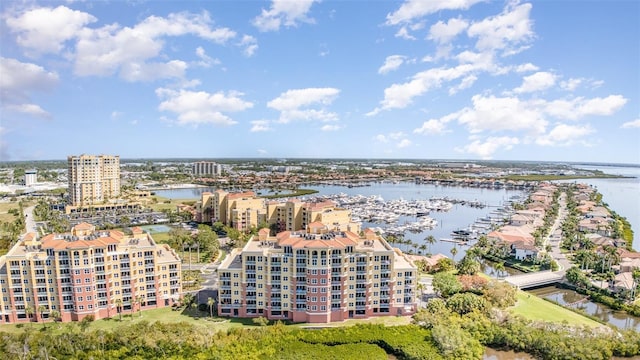 615 Riviera Dunes Way Unit 208, Palmetto, FL 34221 - drone / aerial view of a nearby body of water and a marina