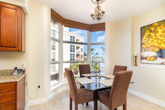 615 Riviera Dunes Way Unit 208, Palmetto, FL 34221 - dining room featuring light tile patterned floors and a chandelier