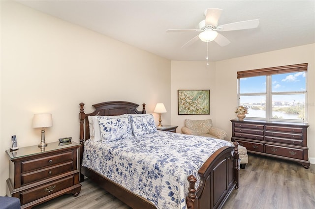 615 Riviera Dunes Way Unit 208, Palmetto, FL 34221 - bedroom featuring wood finished floors and a ceiling fan